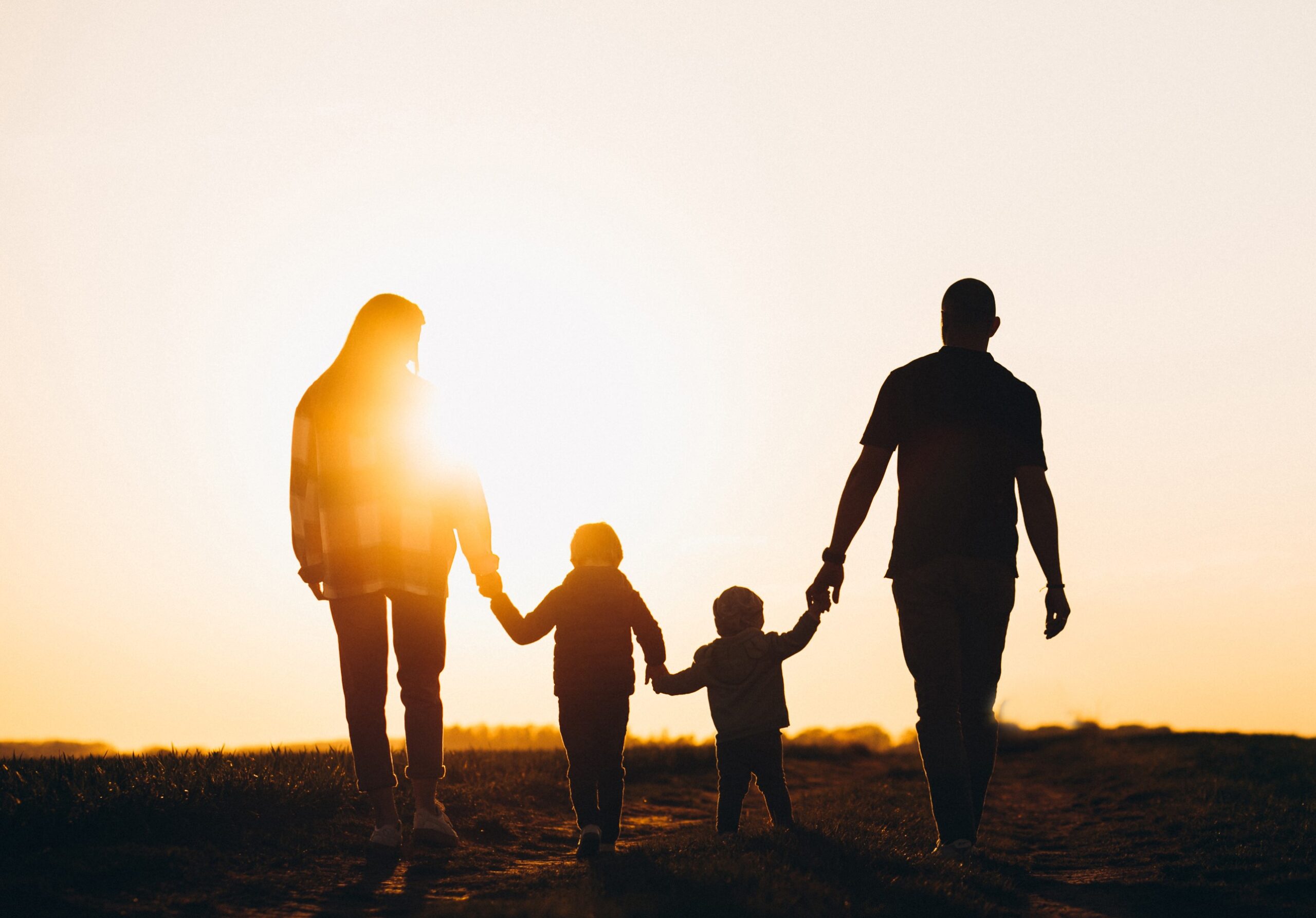 Happy family silhouette on the sunset